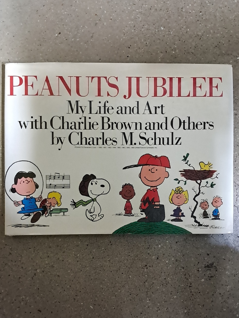 Peanuts Jubilee by Charles M. Schulz - White Cover with Red Title